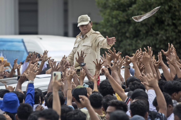 Prabowo Subianto tosses a T-shirt to supporters during a campaign rally in Medan last weekend.