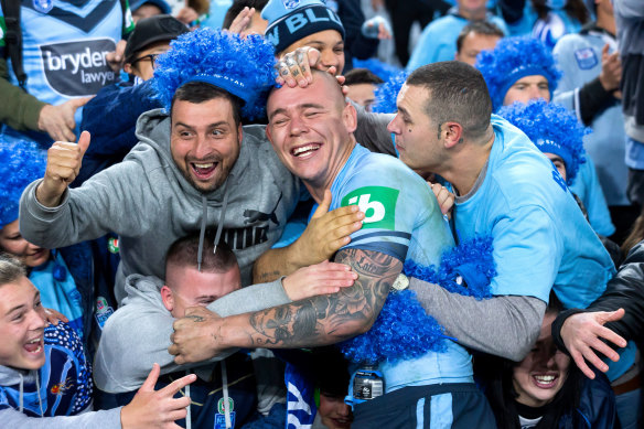 The NRL hopes crowds will be back for November's Origin series but it's unlikely to resemble anything like this, as David Klemmer celebrates with fans in 2018.
