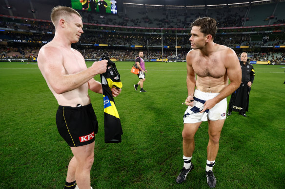 Jack Riewoldt and Tom Hawkins swap jumpers after Richmond’s win.
