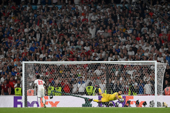 The crowd watches Italy save an English penalty in a shootout during the final of the UEFA Euro 2020 on July 11.