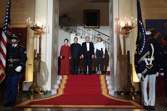 President Donald Trump and first lady Melania Trump pose for a photo with China’s President Xi Jinping and his wife Peng Liyuan at the state dinner. 