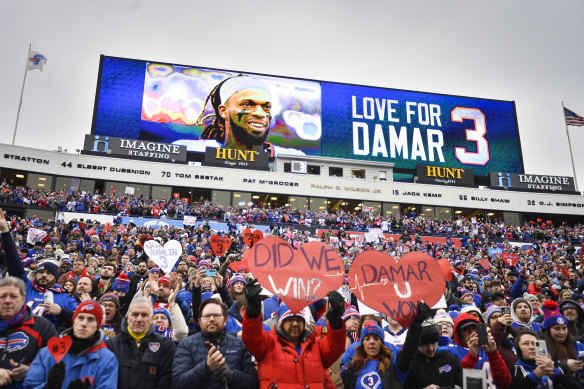 Fans salute Hamlin at Buffalo’s home ground before the win over the Patriots.