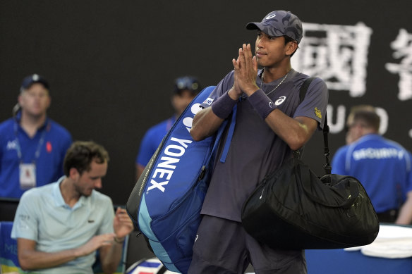 Kasidit Samrej of Thailand gestures as he leaves Rod Laver Arena after his first-round loss to Medvedev.