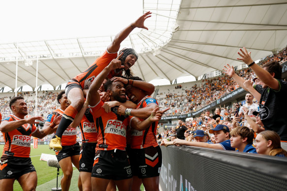 Sunia Turuva and the Tigers celebrate a try against the Eels.