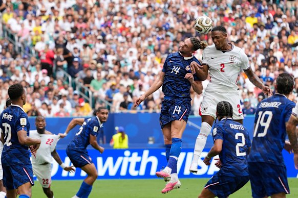 Konsa heads the ball into the net.