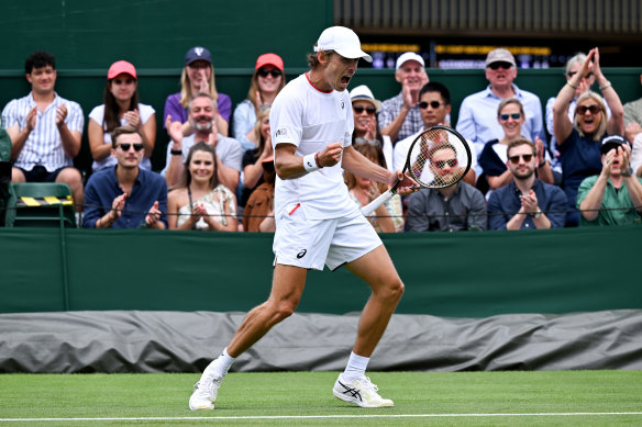 Alex De Minaur celebrates winning match point against Belgium’s Kimmer Coppejans.