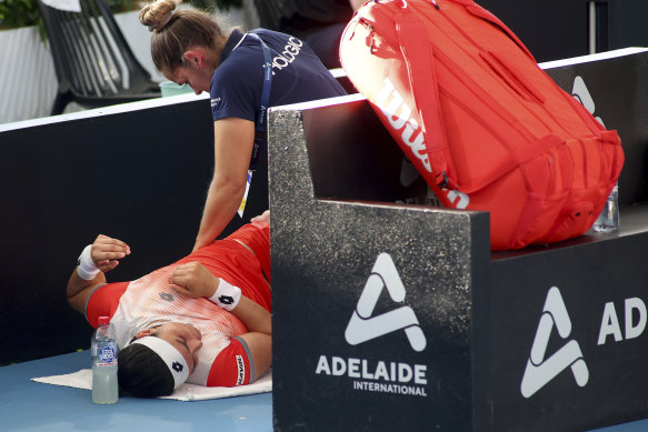 Tunisia’s Ons Jabeur receives treatment during her semifinal match against Czech Linda Noskova at the Adelaide International.