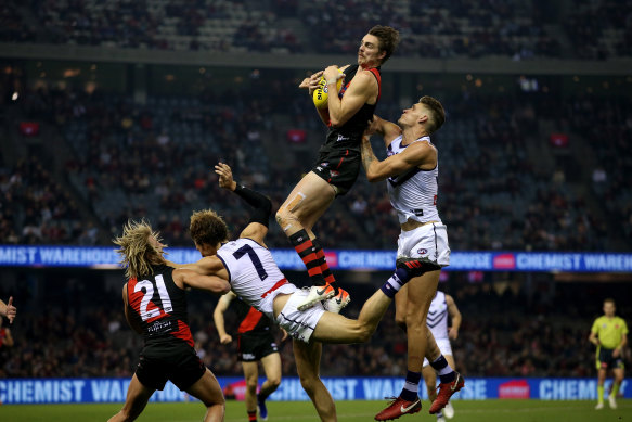 Daniher takes the ball during the round nine against the Fremantle Dockers in May.