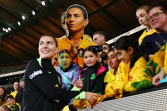 Matildas star Steph Catley mixes with fans at Marvel Stadium on Friday night.