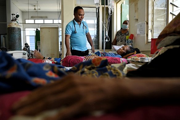 Dr Moses Ataide  spends time talking with patients. There are ten palliative care beds for the entire country. 