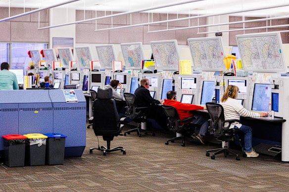 Banks of radar scopes at the Melbourne air traffic control services centre.
