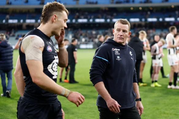Blues coach Michael Voss and Patrick Cripps of the Blues look dejected after a loss.