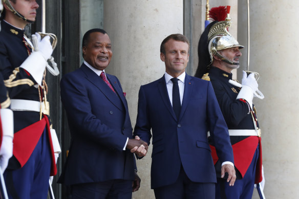 Republic of Congo President Denis Sassou Nguesso, left, is greeted by French President Emmanuel Macron before a meeting at the Elysee Palace in Paris in 2019.
