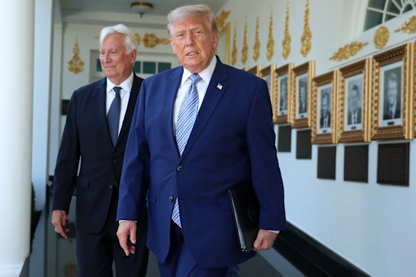 Mark Walter, pictured here with US President Donald Trump, bought a majority stake in the Lakers just over a year ago, in a deal valued at $US10 billion. Walter’s investment empire is under investigation. 