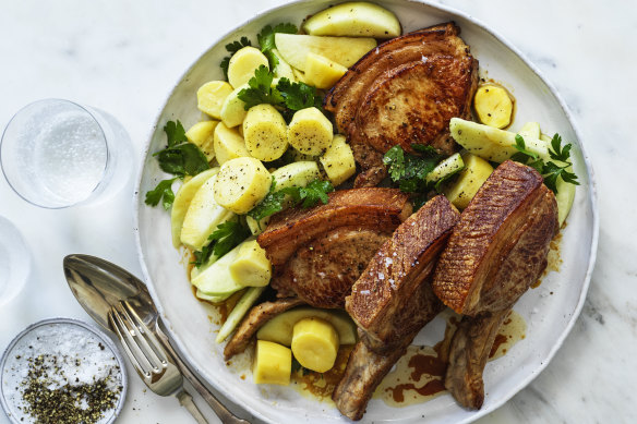 Barbecued pork chops with apple and potato salad.