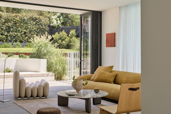 The stylish living room opens out to the backyard.