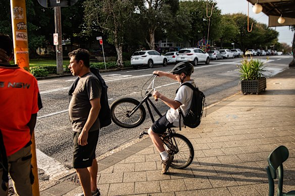 A bike rider on the intersection of Unwins Bridge Road and Railway Road.
