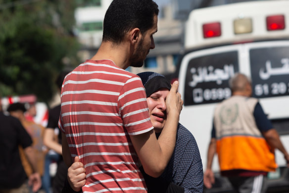 A woman cries during a funeral procession at Al-Shifa Hospital in Gaza City.