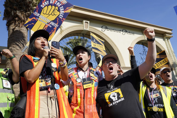 SAG-AFTRA captains Iris Liu and Miki Yamashita and chief negotiator Duncan Crabtree-Ireland with striking actors outside Paramount Pictures studio in LA on Friday.