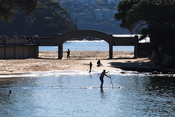 Beachgoers enjoy the winter sun at Balmoral.