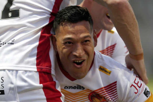 Folau celebrates his try after a lightning-fast start on debut for Catalans.