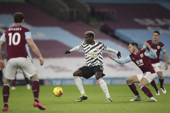 Paul Pogba broke the deadlock at Turf Moor to send Manchester United to the Premier League summit.