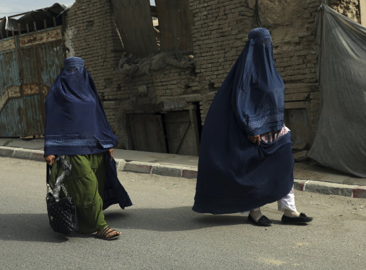 Two Afghan women walk along a street in Kabul. Tim Bonyhady sees women’s dress as the image of modernity.