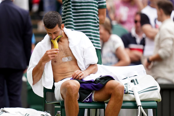 Novak Djokovic eating a banana during his quarter-final match against Andrey Rublev at Wimbledon last year. 