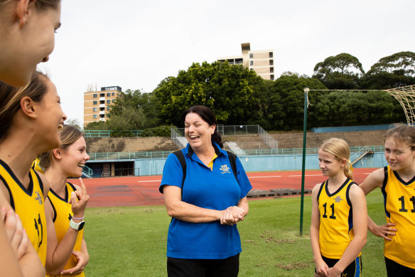Comonwealth Games gold medallist Kath Sambell describes to her Kambala students a gash she received while training with Cathy Freeman at ES Marks Athletic Field in 1990.