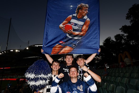Geelong fans pose before the match.