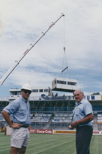 Local businessmen Laurence Lancini and Joe Goicoechea helped finance the stadium, pictured here having its media box installed atop the old paceway grandstand. 
