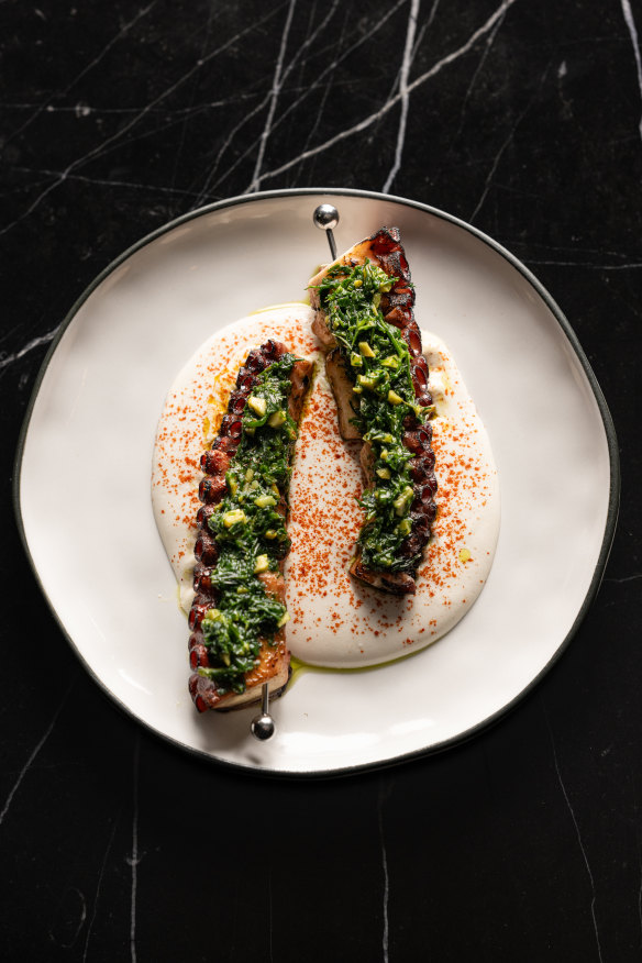 Octopus skewers with green olives and almond sauce.