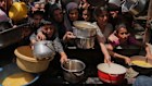 Palestinians struggle to get food aid in Jabalia in northern Gaza on May 19.