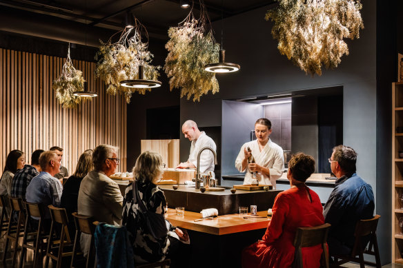 Lachlan Colwill and Sophie Pope behind the Omotenashi counter inside Hobart’s Lexus showroom.