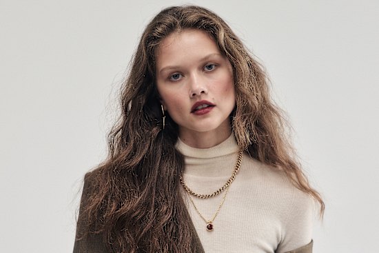 Lee Mathews cashmere turtleneck, $649. Zimmermann “Dawning” skirt, $1750. Temple of the Sun “Mythos” bracelet, $369.