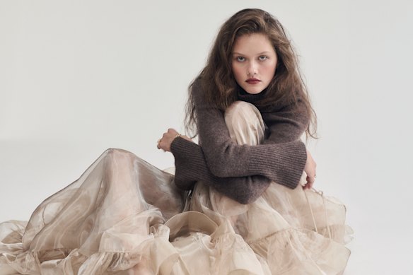 Lee Mathews cashmere turtleneck, $649. Zimmermann “Dawning” skirt, $1750. Temple of the Sun “Mythos” bracelet, $369.
