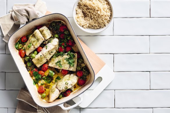 Mediterranean baked fish with cherry tomatoes and olives.