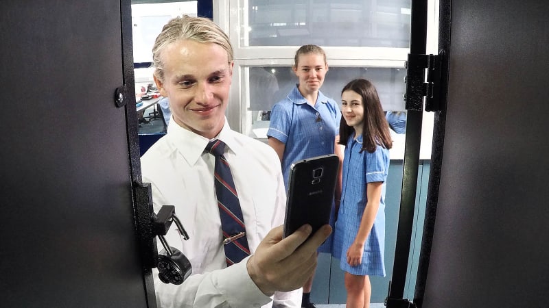 Noise levels dialled up as school's total phone ban gets kids talking
