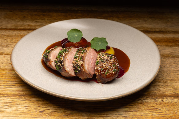 Dry-aged duck breast, with golden beet, pistachio and duck neck sausage.