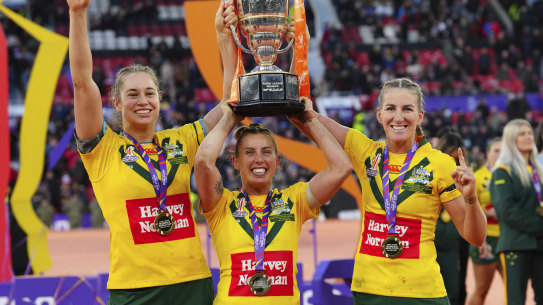 The Australian team celebrate with the World Cup. 
