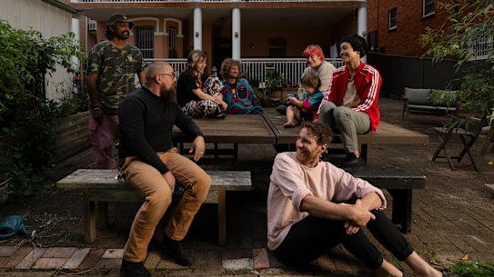 Kelly (front) and his group of friends, who bought a block of units together in Sydney.