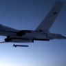 A Russian Tu-160 strategic bomber fires a cruise missile at test targets, during a military drills, Russia. 