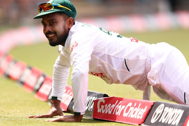  Mehidy Hasan Miraz of Bangladesh is beaten by the boundary rope.