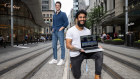 The Loom co-founders pose with their app outside Atlassian’s offices in central Sydney.