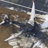 The burnt out Japan Airlines plane that collided with another aircraft on Tuesday evening. All 379 passengers and crew safely evacuated, though five people on board the other plane were killed.