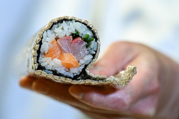 Remove the mat. Your sushi roll is ready to slice up and serve.