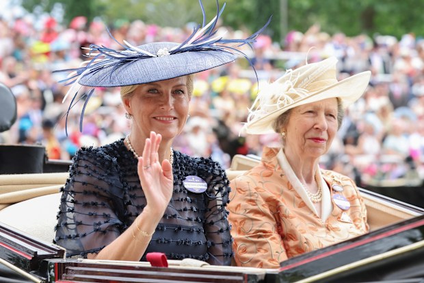 Sophie, Duchess of Edinburgh and Princess Anne, Princess Royal smile and wave as they attend day three of Royal Ascot 2026