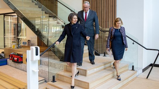   NSW Premier Gladys Berejiklian, Health Minister Brad Hazzard and Chief Health Officer Kerry Chant tour the mass-vaccination centre at Sydney Olympic Park on Wednesday morning.
