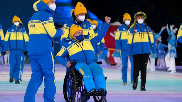Athletes from Ukraine arrive at the opening ceremony at the 2022 Winter Paralympics in Beijing.