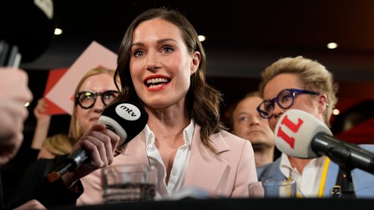 Sanna Marin peaks to media reacts as she watches results of exit polls in Helsinki.